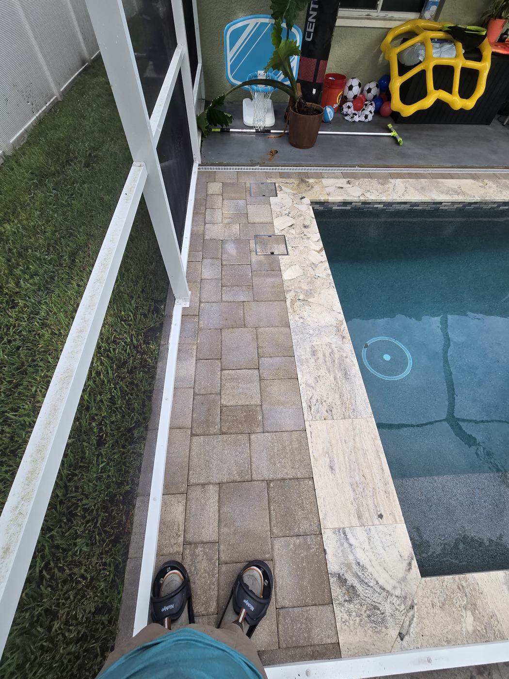 Travertine pool coping in Tampa after natural stone sealing, with clean, protected stone and crisp joints