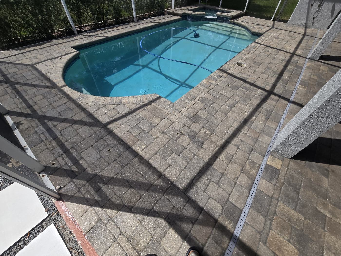 Pool deck pavers after professional paver sealing in Tampa, FL, with restored color and a wet-look finish