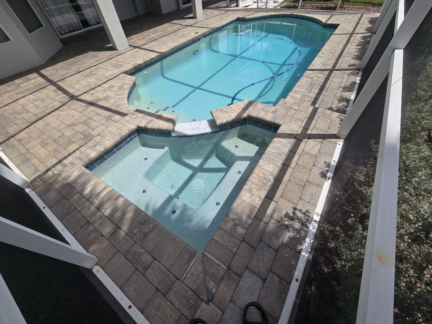 Pool and spa deck pavers in Tampa after paver sealing, with deepened color and a protected finish